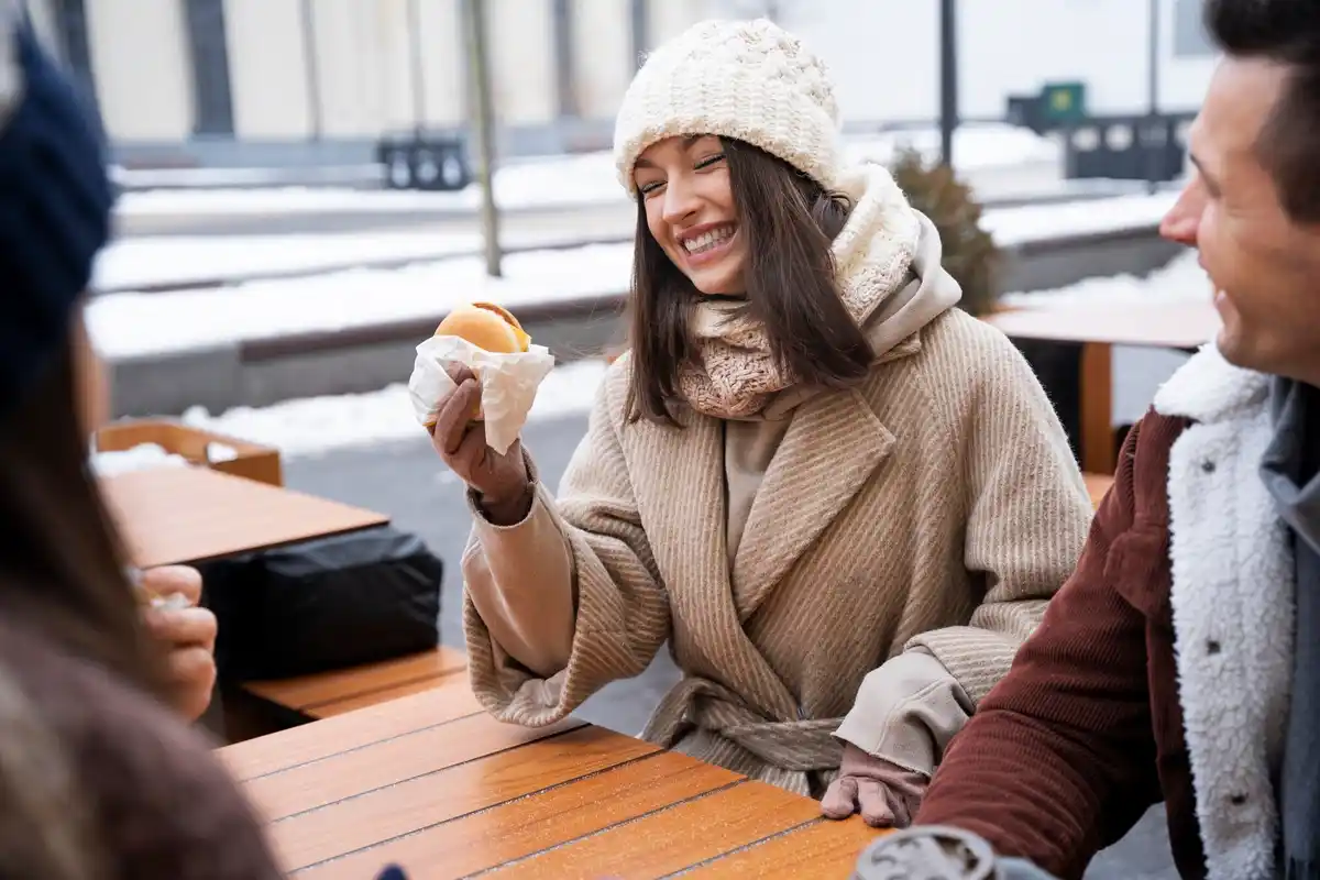 young people paying with mobile phone in Prague cafe