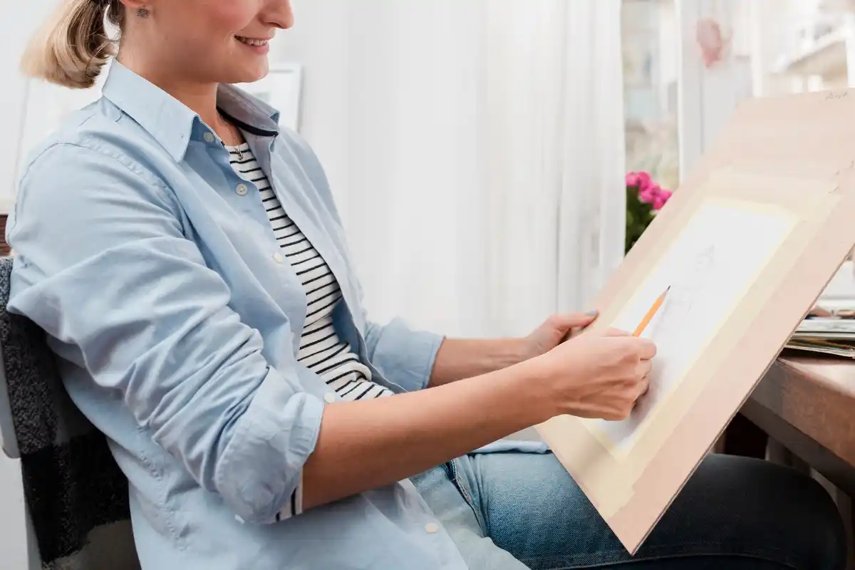 active senior woman painting canvas home