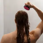hot shower damaging hair closeup european woman