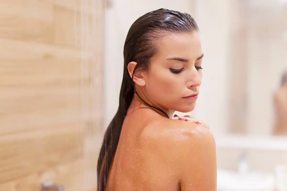 hot shower damaging hair woman bathroom european