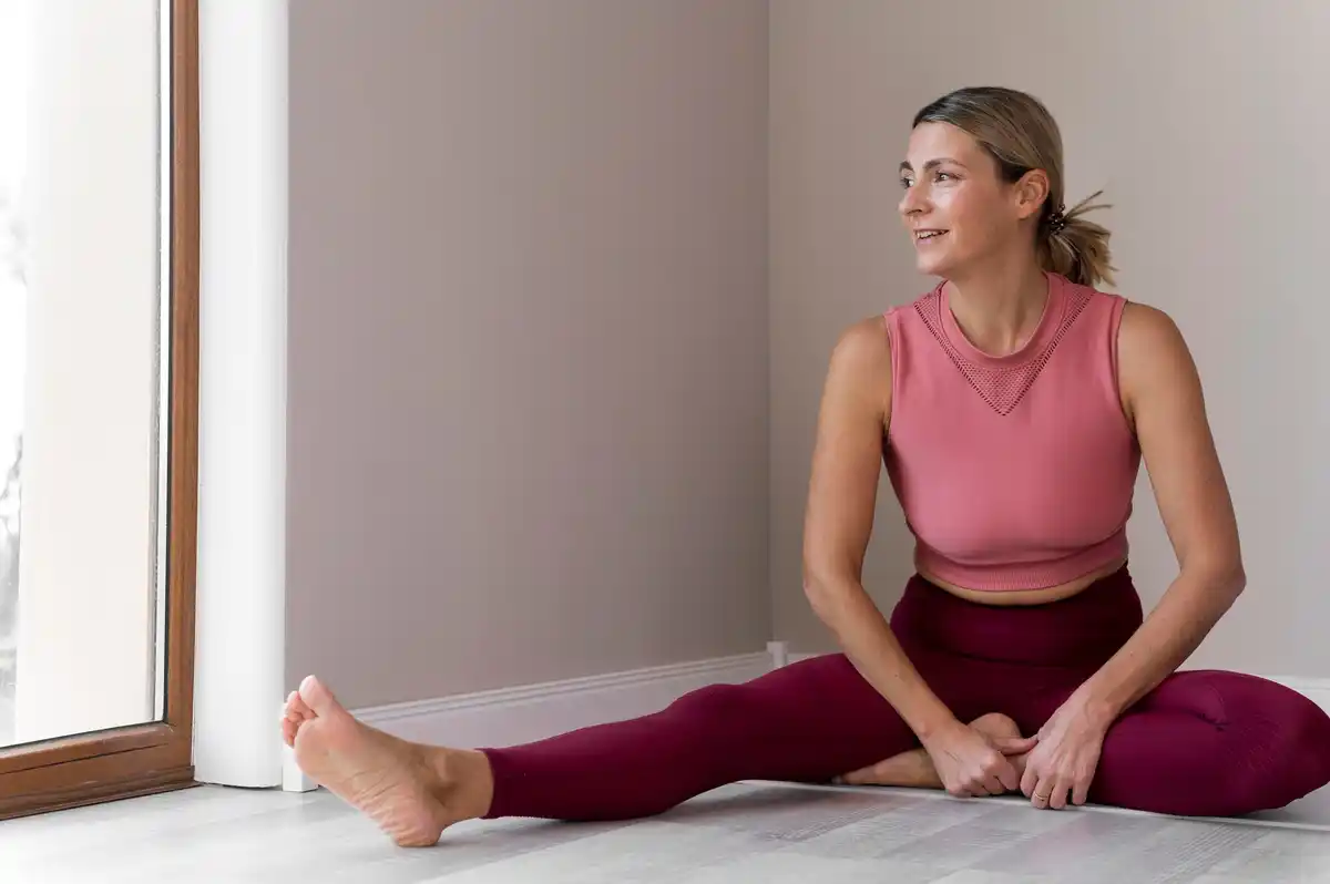 mature woman stretching awkwardly at home