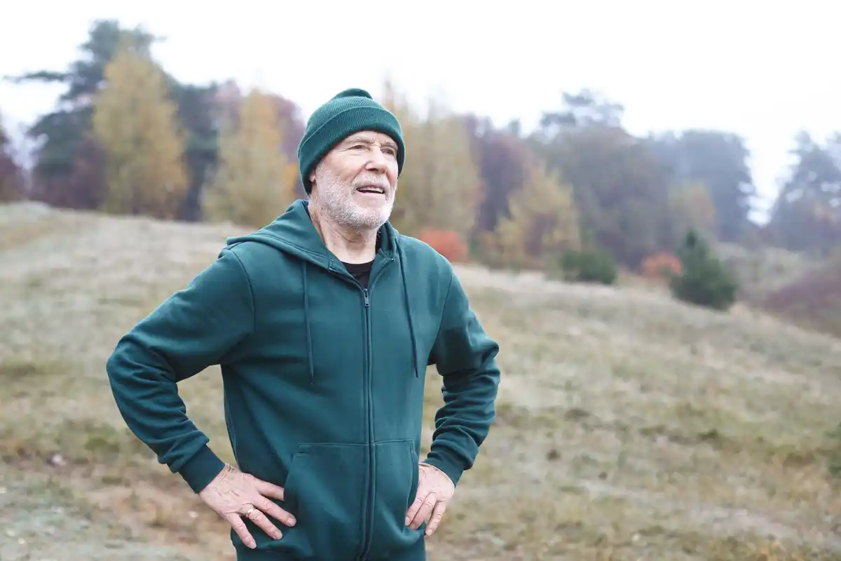 Czech mature man breathing deep outdoors