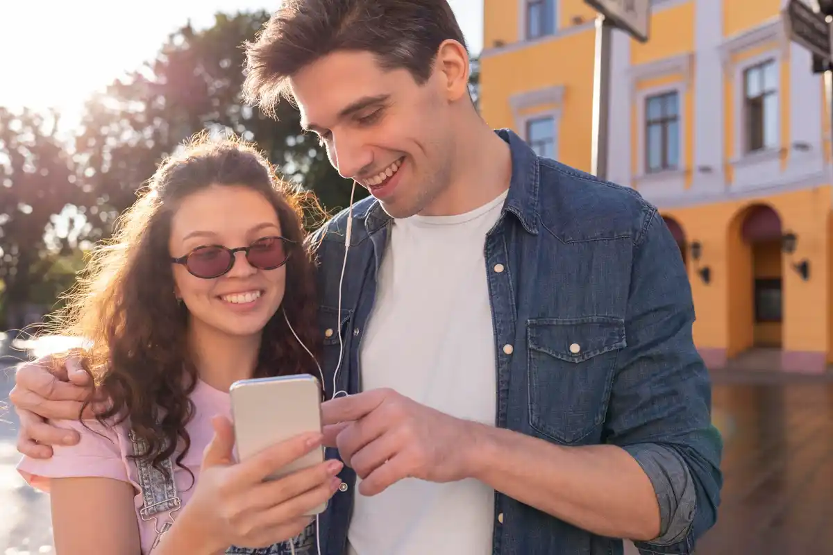 young czech couple using smartphones dating app