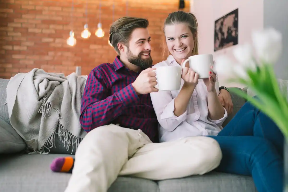 happy czech couple relaxing at home