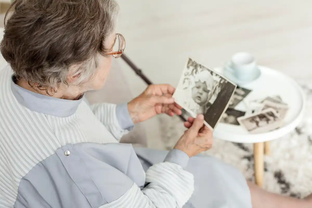 grandparents laughing at old family photo album