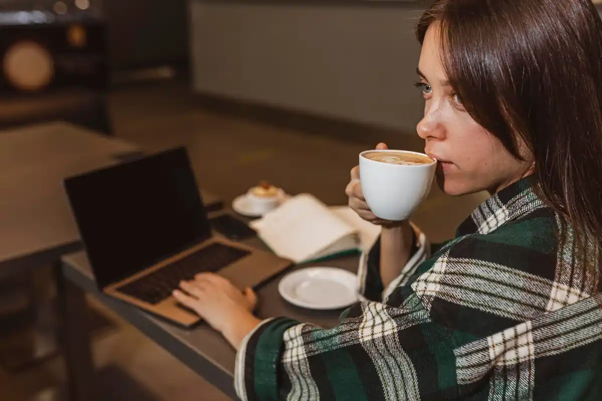 czech student deep work laptop cozy cafe