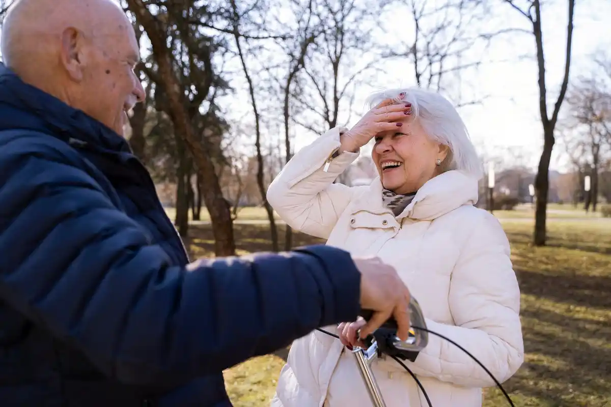elderly czech couple walking park spring