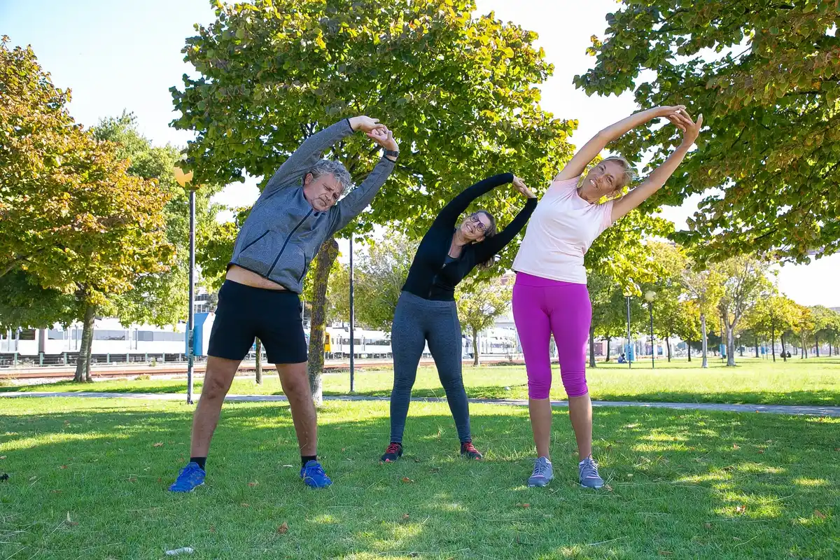 dynamic warm up outdoors before sports group