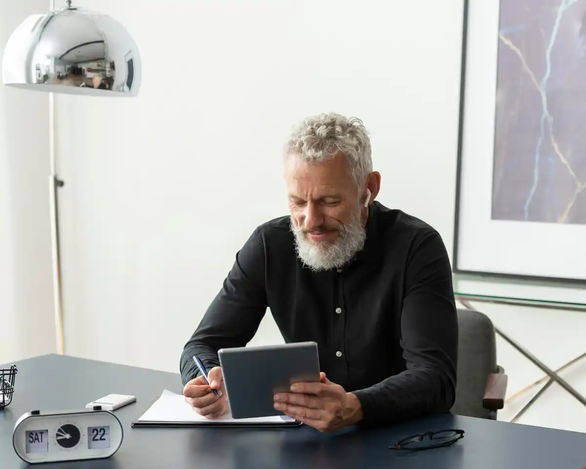 senior using smartphone with notes