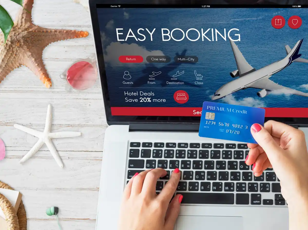 cheap flight booking tuesday evening airport laptop