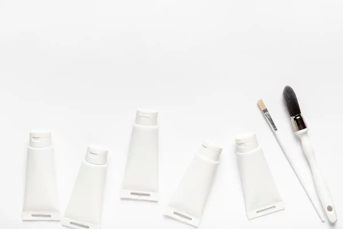 empty cosmetic containers travel flat lay minimalist