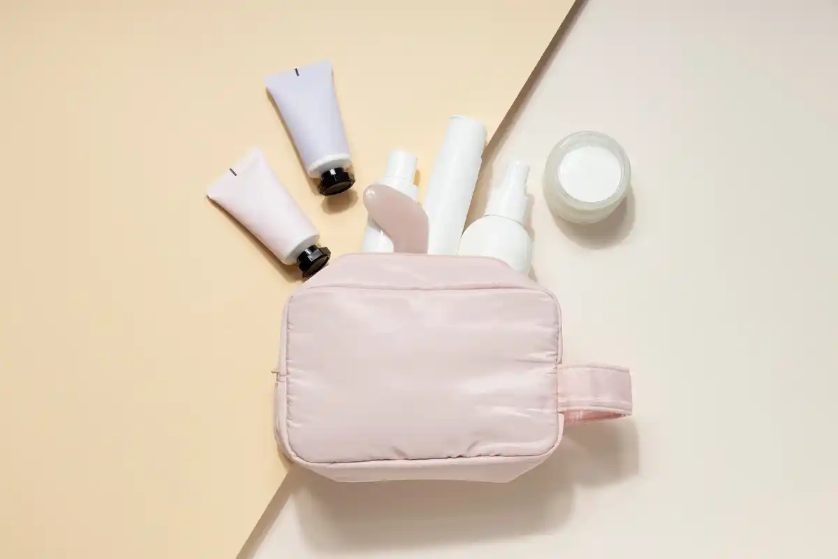 minimalist cosmetics travel kit flatlay